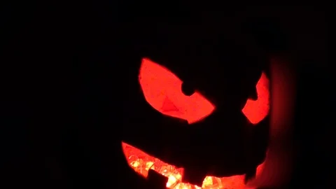 Evil pumpkin is rotated in the frame Video stock 85853159