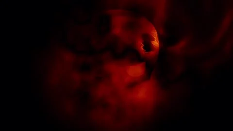 Evil skull face with fire glow on dark background Video stock 272796026