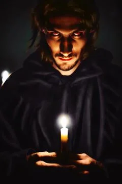 Evil sorcerer with a candle 库存照片