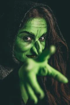 Evil witch casting a curse Stock Photos