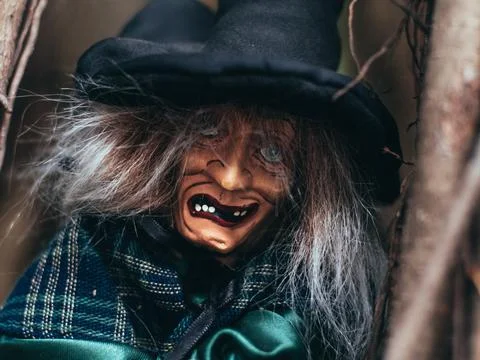 Evil witch on nature dark background, closeup portrait of old lady with terri Stock Photos