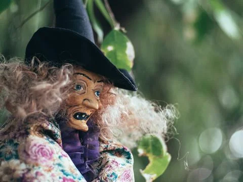 Evil witch on nature dark background, closeup portrait of old lady with terri Stock Photos