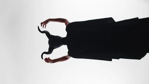 Evil witch queen waving her hands, casting a magic spell, view from her back Stock Footage 209150159