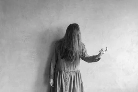 Evil woman beckoning someone Stock Photos