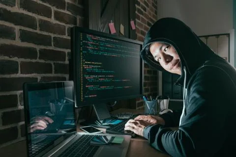 Evil young computer programmer as hacker Stock Photos