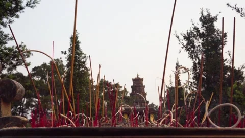 Evocative close-up of fragrant incense sticks burning Stock Footage 340511488
