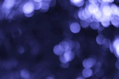 Evocative Play of Light Abstract Bokeh Background in Serene Violet Hues Stock Photos