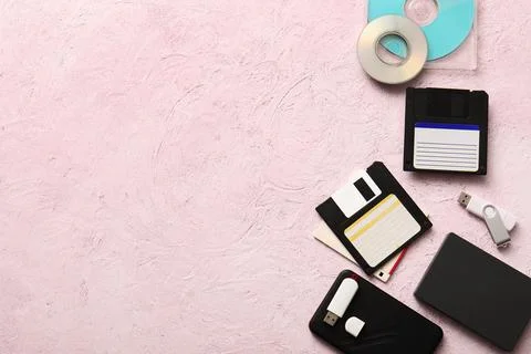 Evolution of data storage devices with floppy disks, usb flash drives, and cd Stock Photos