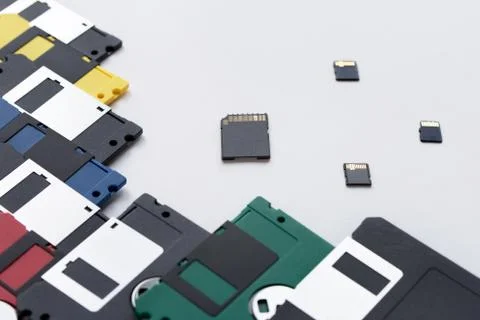 The evolution of digital data storage device. Floppy disks and memory cards. Stock Photos