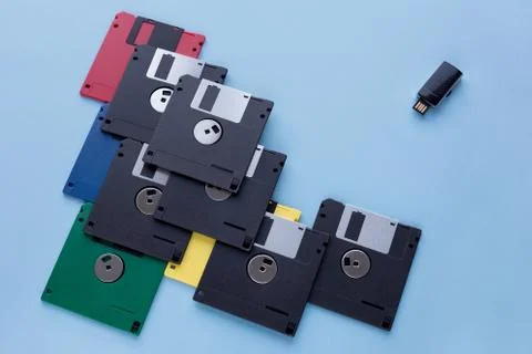 The evolution of digital data storage device. Floppy disks vs  flash drive. Stock Photos