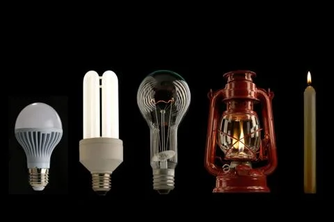Evolution of lighting light sources isolated on a black background, studio shot Foto stock