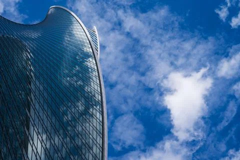 Evolution Tower reflection Blue Sky with Clouds Foto stock