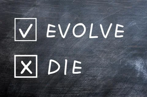 Evolve or die check boxes on a smudged blackboard Stock Photos