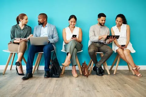 Evolving with modern business. Full length shot of a diverse group of Stock Photos