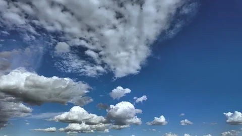 Evolving Tiny Fluffy Cumulus Clouds Evolving Under a Bright Blus Sky. Timelapse. Stock Footage 335449777