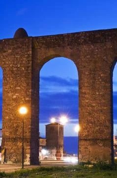 Evora aqueduct by night Stock Photos