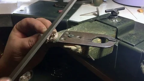 Eweler makes a ring of silver in the workshop Stock Footage 72959740