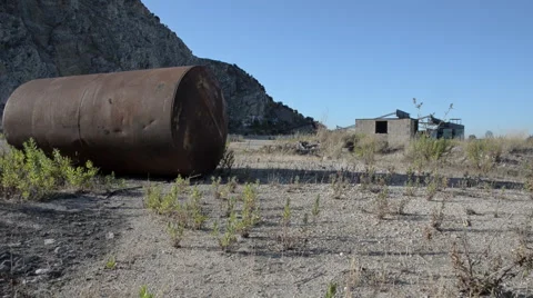 Ex marble quarry with abandoned rusty gas tank Stock-Footage 57851378