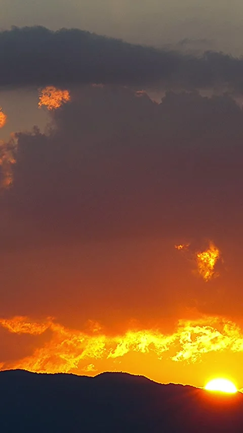 The exact moment sun sets while beautifully illuminating clouds Japan dusk,01 Stock Footage 340537246