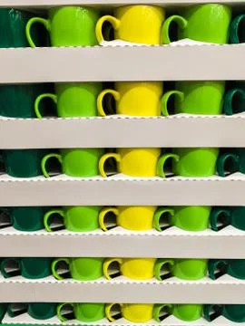 Exactly stacked multicolored cups in rows and columns Foto stock