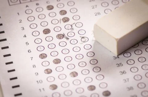 Exam carbon paper computer sheet and eraser Stock Photos