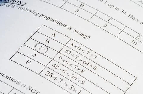 Exam paper with mathematics problem solving. Stock Photos
