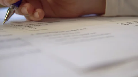 Exam test form, taking exams, hand with pen close up Stock Footage 129469194
