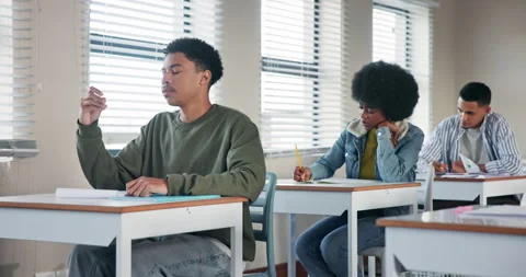 Exam, thinking and question with student in classroom of school for assessment Stock Footage 279001898