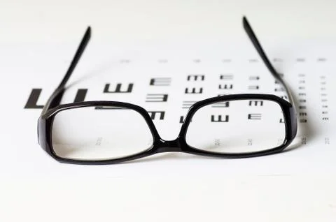 Exam view with Glasses on optometric table Stock Photos