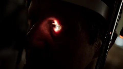 Examination of the fundus of the eye in a mans eye with a special light from a Video stock 318288557