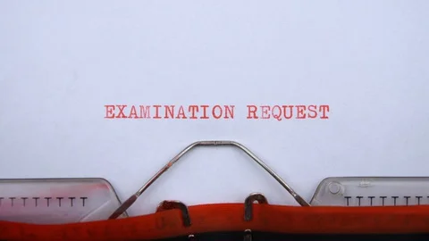 Examination request - phrase printed on an old typewriter in red letters Stock Footage 128400163
