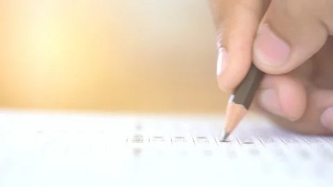 Examination test concept, close up pencil on test answer paper, pencil on hand 動画素材 96049044