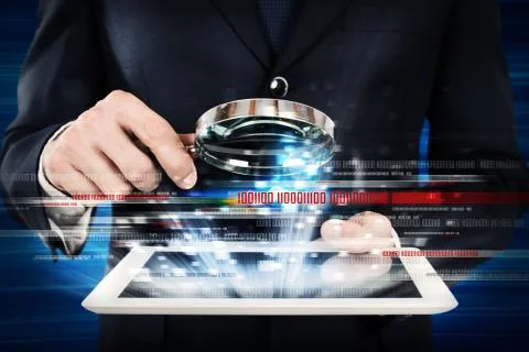 Examine a computer tablet 库存照片