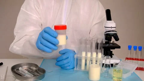 Examine milk in the laboratory. Selective focus. Stock Footage 309911962