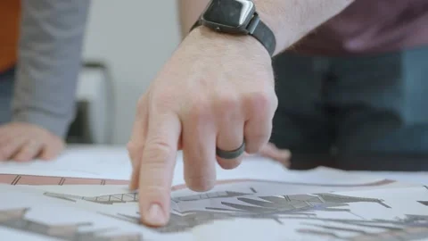 Examining Building plans Stock Footage 238859091