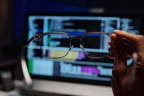 Examining Code Reflections in Eyeglasses Lens Stock Photos