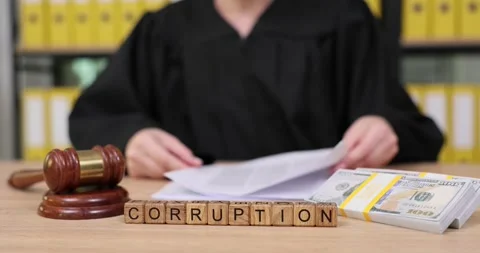 Examining corruption through justice system symbolism in a courtroom setting Stock Footage 320187043