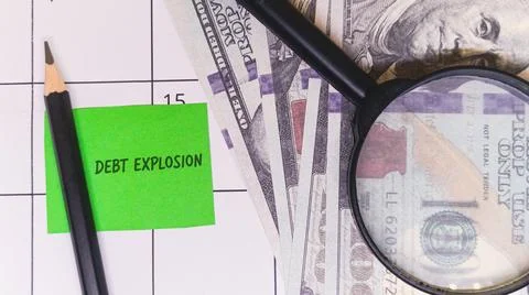Examining Debt Explosion Stock Photos