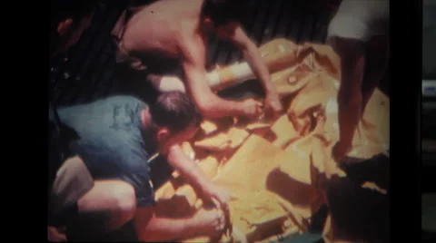 Examining of deflated lifeboat on deck Stock Footage 37597170