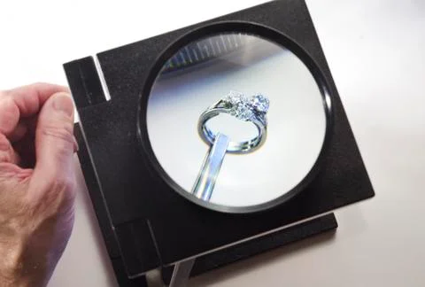 Examining diamond ring Stock Photos