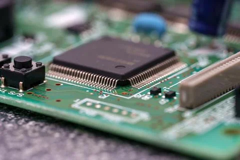 Examining electronic components on a circuit board, noticing the tiny detai.. 写真素材