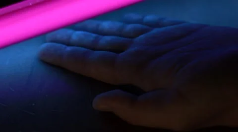 Examining hand with ultraviolet lamp Video stock 64847187