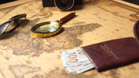 Examining the map with a magnifying glass, close up. Stock Footage 125395543