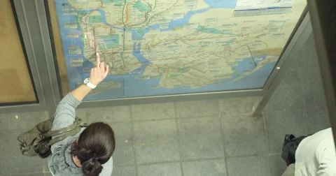 Examining Map in Subway Station Stock Footage 42660419