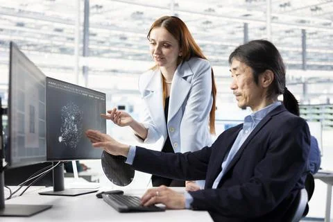 Examining microchip circuit design, AI and female technician with coworker Stock Photos