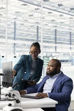 Examining microchip circuit design, specialized software and engineers Stock Photos
