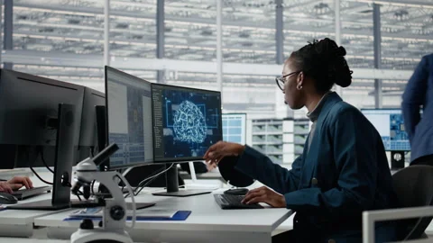 Examining microchip circuit layout, artificial intelligence and developer Stock Footage 335879450