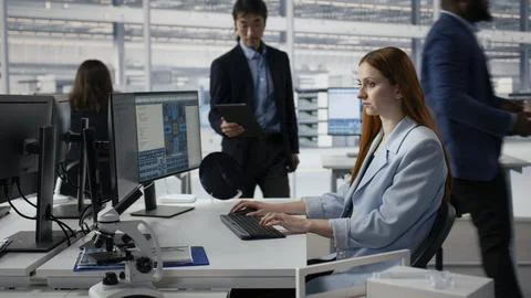 Examining microchip circuit layouts, computer and senior manager with woman Stock Photos