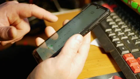Examining phone with broken touchscreen in the cell phone service Stock Footage 168945913