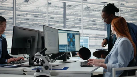 Examining semiconductor substrate, working together and women in office Stock Footage 335879279